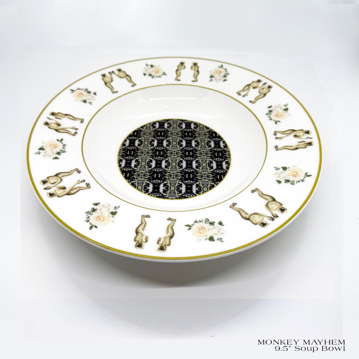 MONKEY MAYHEM Rimmed 9.5 in. soup bowl features a center pattern with monkeys playing pat-a-cake around the rim.